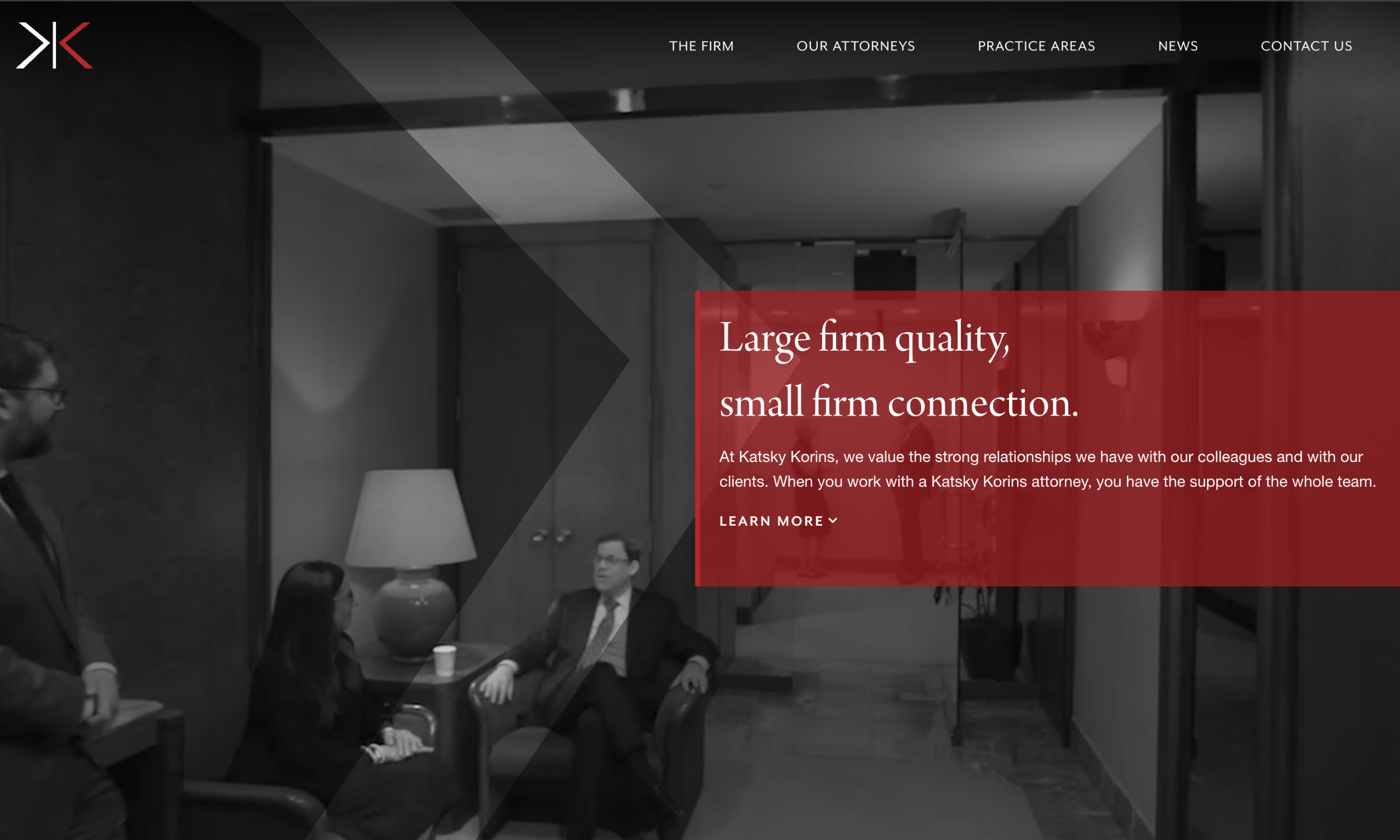 Katsky Korins desktop homepage hero featuring firm tagline and office interior background.